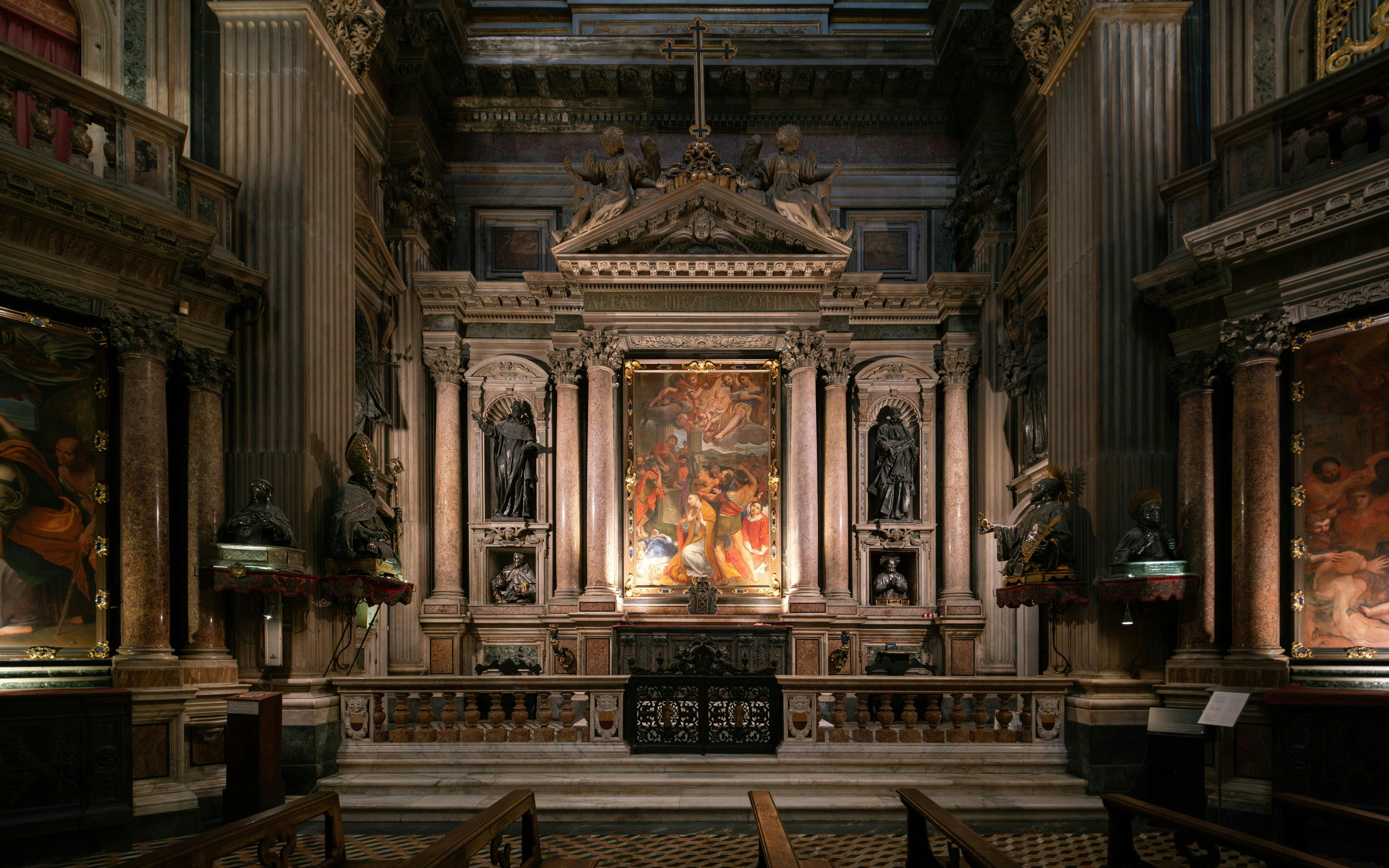 Royal Chapel of the Treasure of San Gennaro interior with ornate altar and religious artwork.