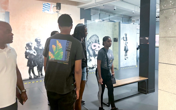 Visitors exploring Banksy artwork at the Banksy Museum.