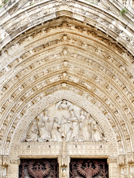 Cathedral of Toledo ornate entrance with detailed stone carvings.