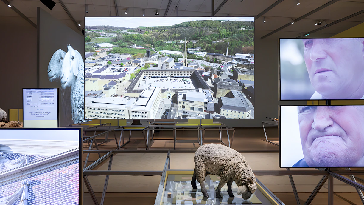 Formafantasma exhibit at Stedelijk Museum, Amsterdam, featuring Oltre Terra installation with multimedia displays.