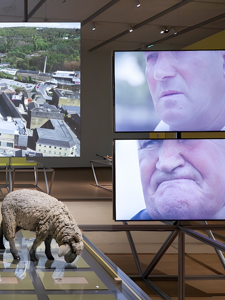 Formafantasma exhibit at Stedelijk Museum, Amsterdam, featuring Oltre Terra installation with multimedia displays.