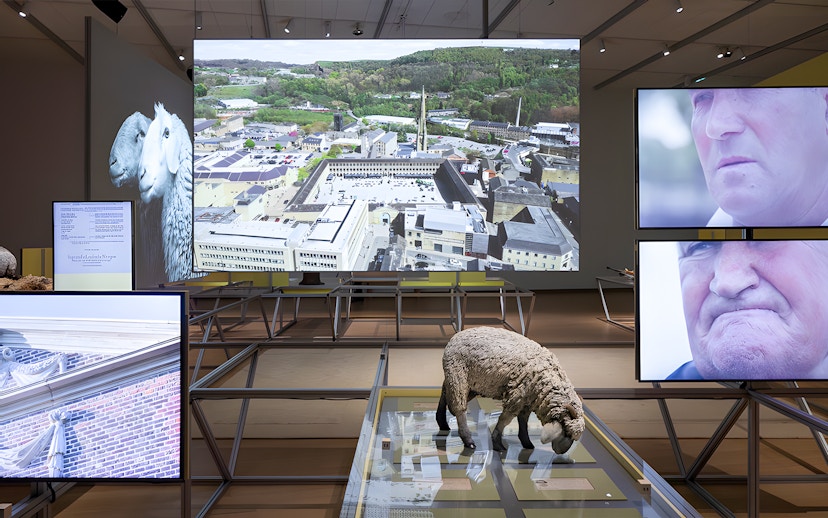 Formafantasma exhibit at Stedelijk Museum, Amsterdam, featuring Oltre Terra installation with multimedia displays.