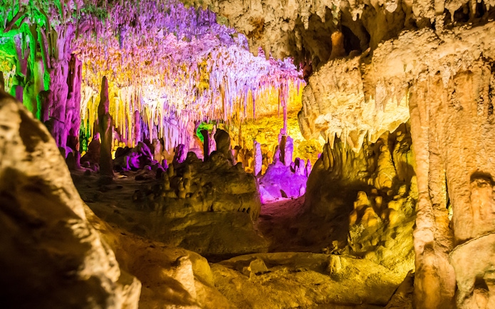 Drach Caves illuminated with colorful lights for a concert in Mallorca, Spain.