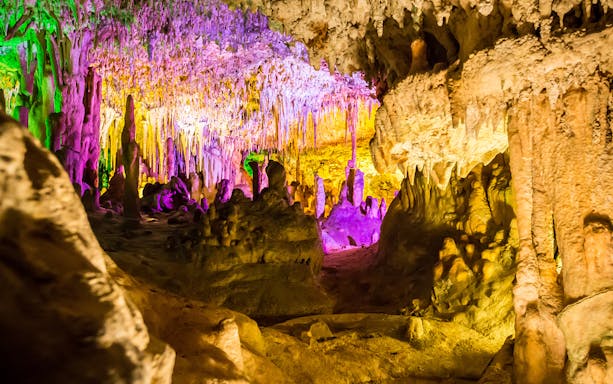 Drach Caves illuminated with colorful lights for a concert in Mallorca, Spain.
