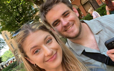 Couple enjoying Bologna city exploration game outdoors.