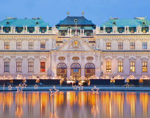 Belvedere Palace in Vienna with holiday timings displayed.