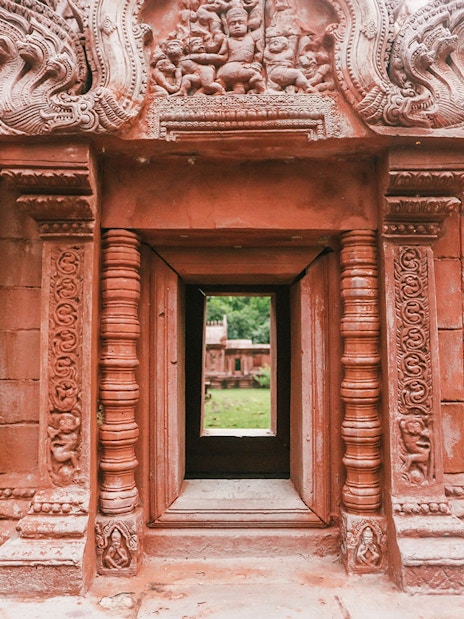 Ornate stone doorway at Ancient City on Erawan Museum tour, Thailand.