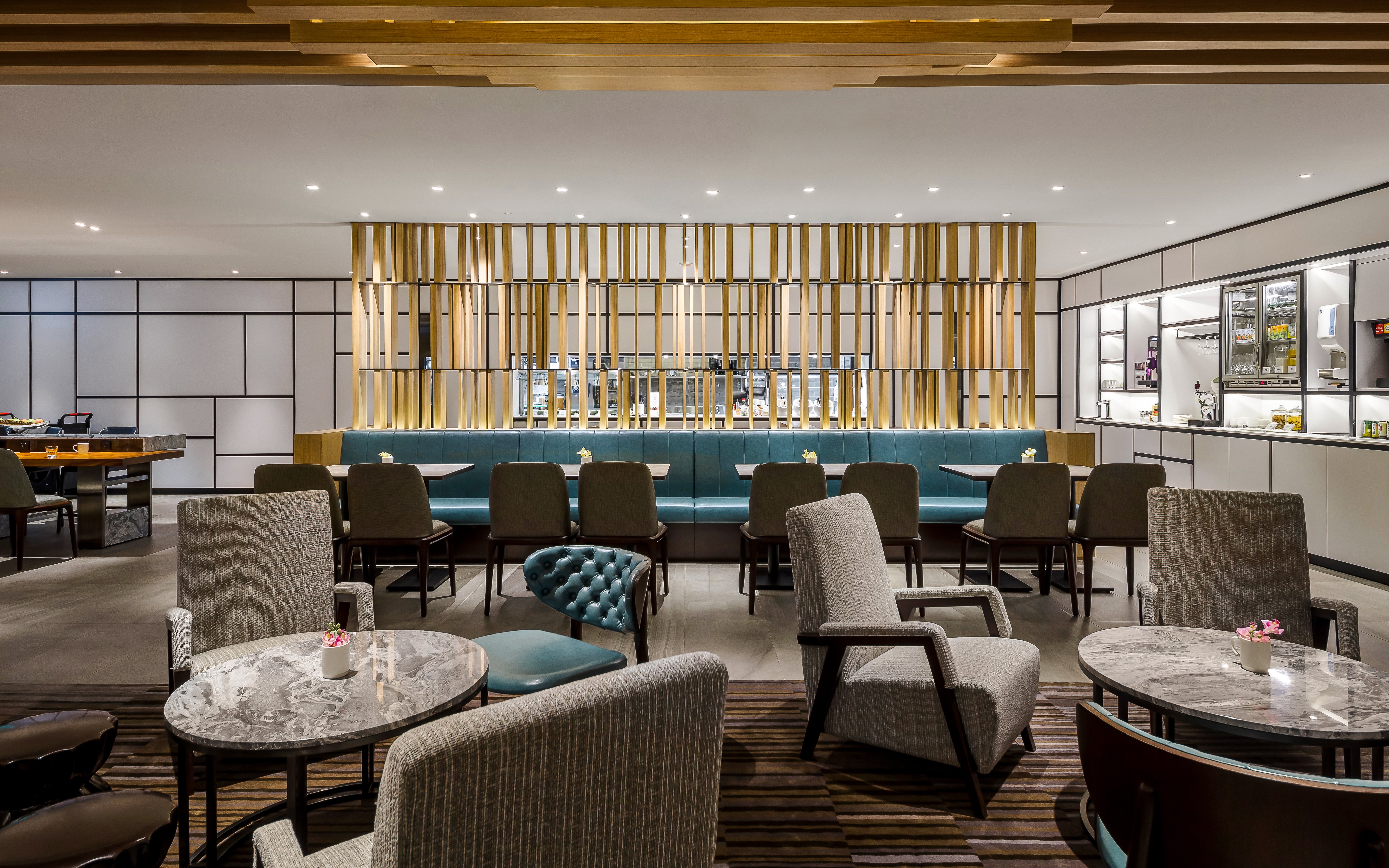 Plaza Premium Lounge seating area with tables and chairs, Zone C, Taipei, Taiwan.