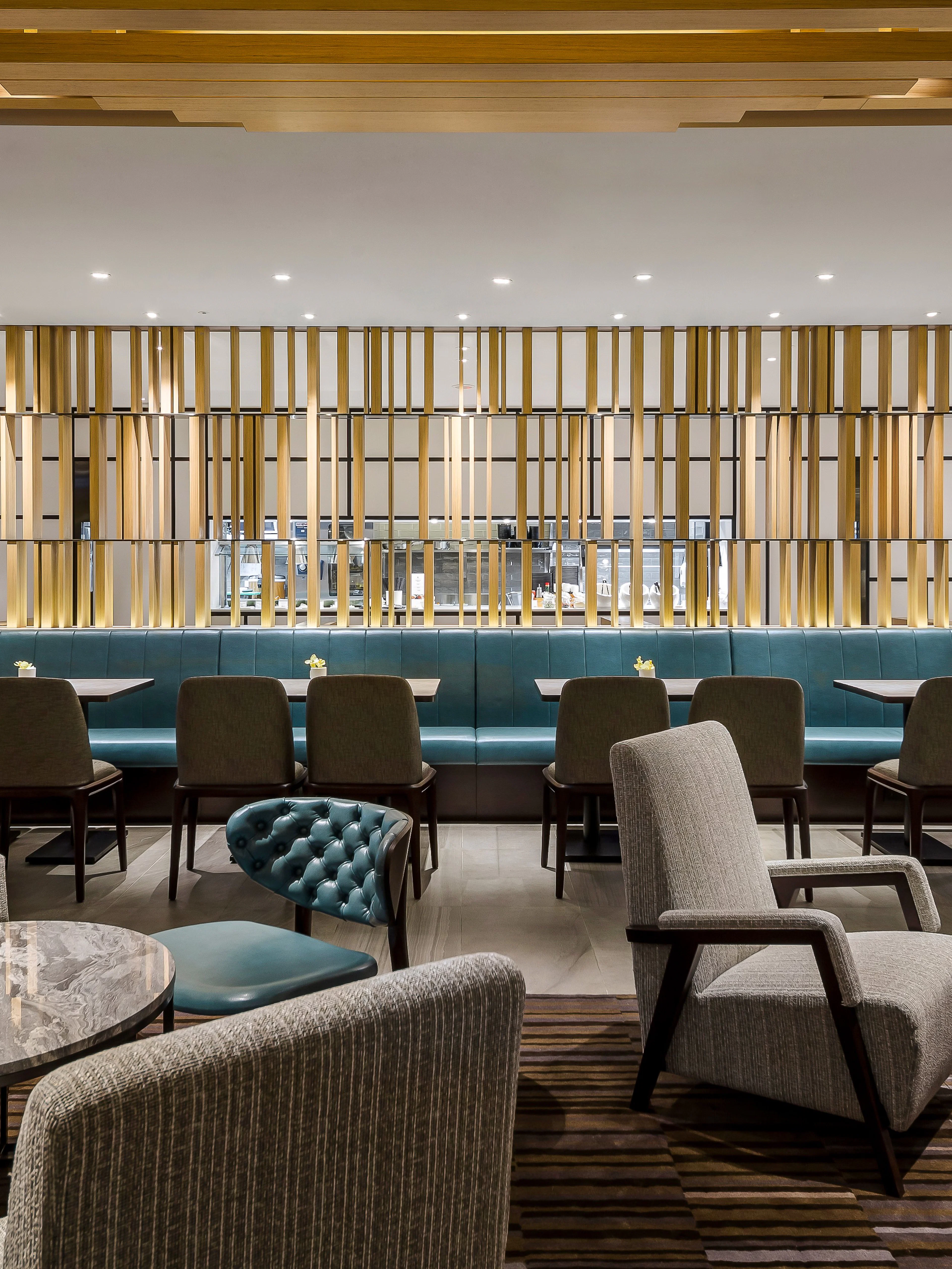 Plaza Premium Lounge seating area with tables and chairs, Zone C, Taipei, Taiwan.