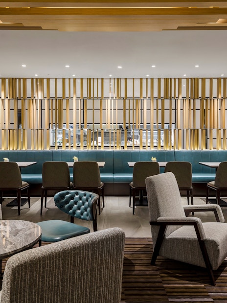 Plaza Premium Lounge seating area with tables and chairs, Zone C, Taipei, Taiwan.