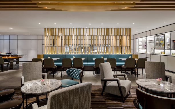 Plaza Premium Lounge seating area with tables and chairs, Zone C, Taipei, Taiwan.