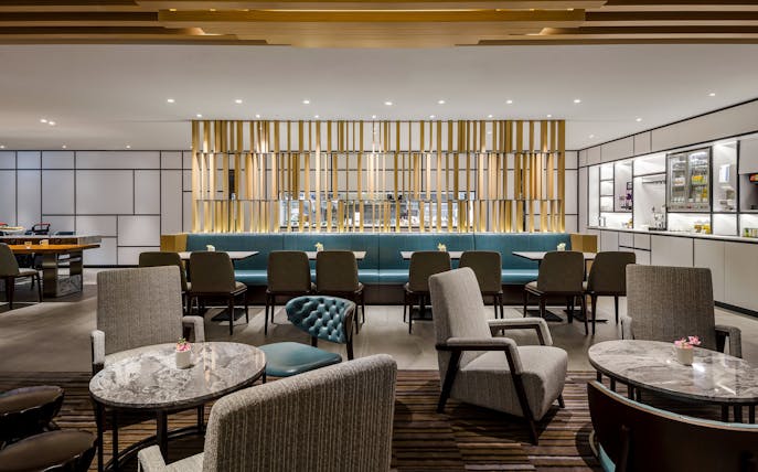 Plaza Premium Lounge seating area with tables and chairs, Zone C, Taipei, Taiwan.