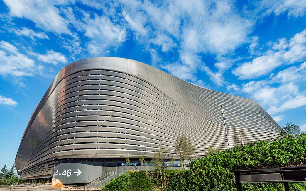 Santiago Bernabeu stadium exterior with modern architecture in Madrid.