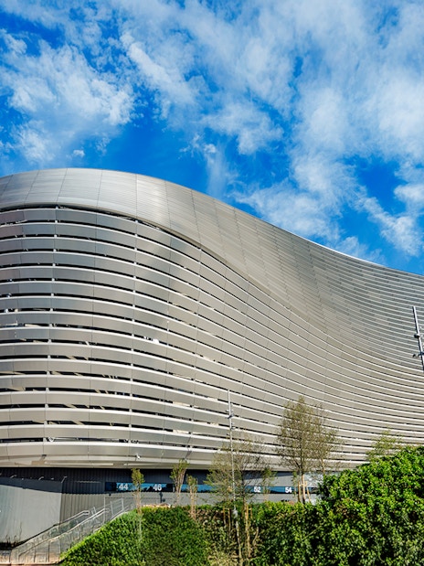 Santiago Bernabeu stadium exterior with modern architecture in Madrid.