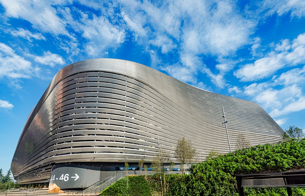 Santiago Bernabeu stadium exterior with modern architecture in Madrid.