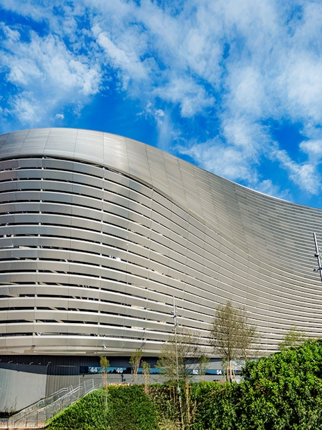 Santiago Bernabeu stadium exterior with modern architecture in Madrid.