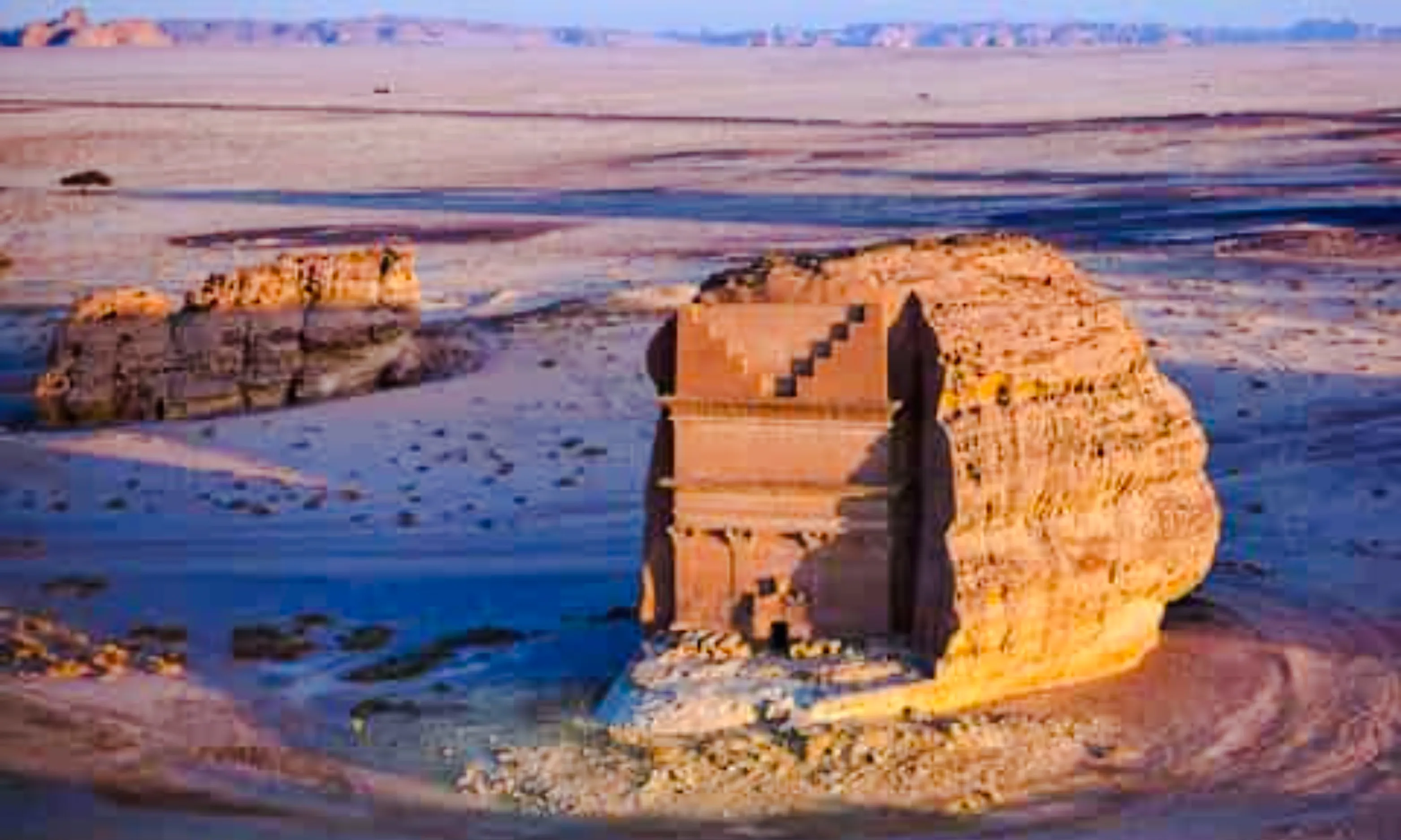 Hegra archaeological site in AlUla, Saudi Arabia, featuring ancient rock-cut tombs.