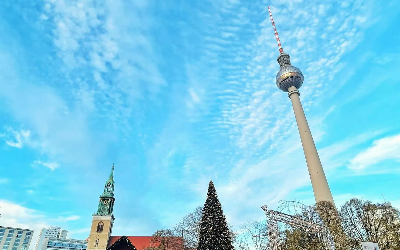 Berlin TV Tower and Christmas tree during city exploration game.
