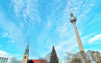 Berlin TV Tower and Christmas tree during city exploration game.