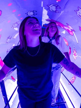 Visitors enjoying interactive digital art at Mind Games - Art Alive! exhibit.