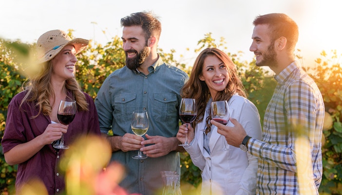 People on a wine-tasting tour in Tuscany