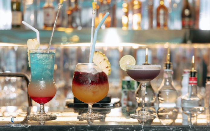 Colorful cocktails on a bar during the Unicorn Dinner Cruise in Bangkok.