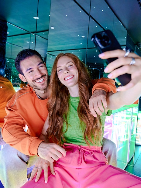 Guests taking a selfie in the mirrored room at Paradox Museum London.