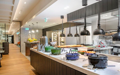 Buffet area at Holiday Inn & Suites Geelong with various food options and modern decor.