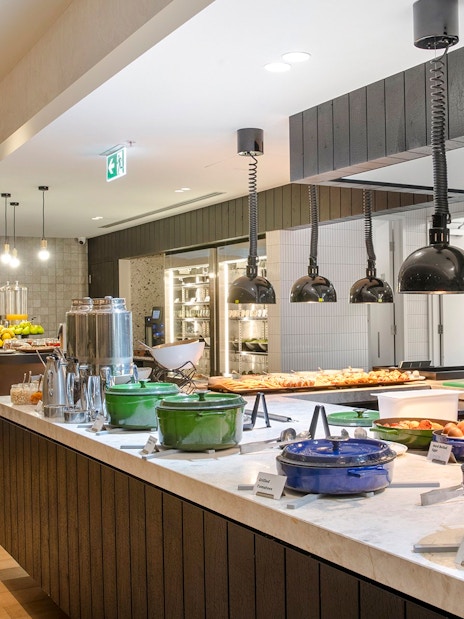 Buffet area at Holiday Inn & Suites Geelong with various food options and modern decor.