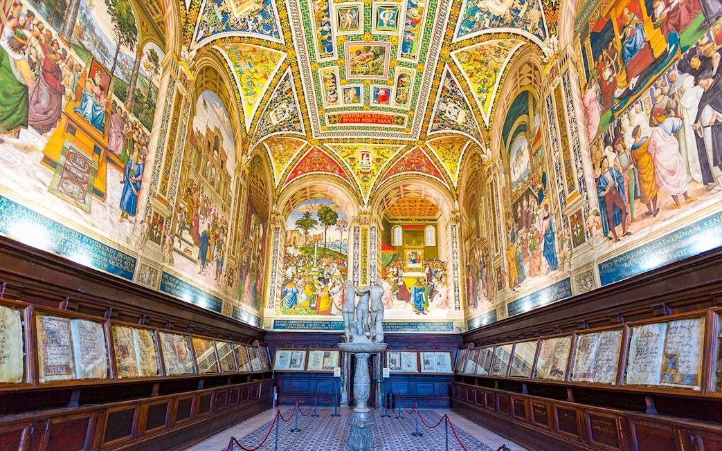 Siena Cathedral interior with vibrant frescoes and detailed architecture on the Gates of Heaven tour.
