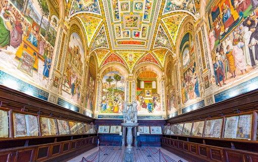 Siena Cathedral interior with vibrant frescoes and detailed architecture on the Gates of Heaven tour.