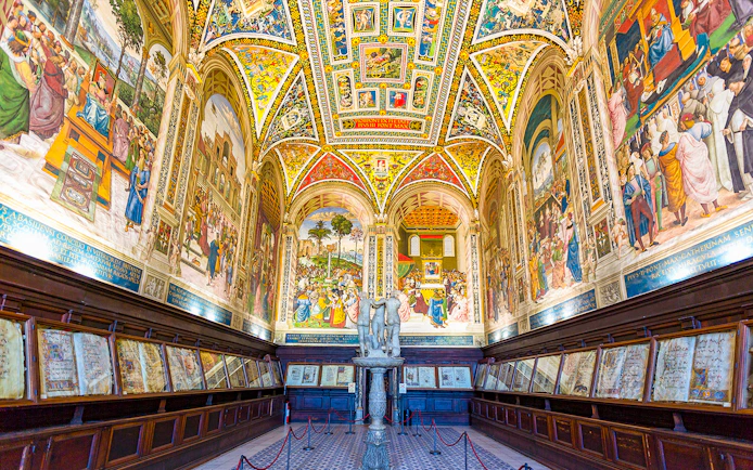 Siena Cathedral interior with vibrant frescoes and detailed architecture on the Gates of Heaven tour.