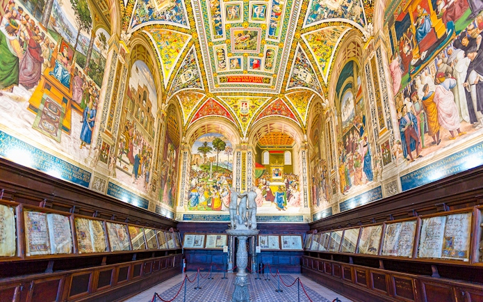 Siena Cathedral interior with vibrant frescoes and detailed architecture on the Gates of Heaven tour.