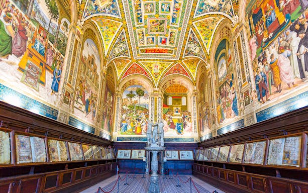 Siena Cathedral interior with vibrant frescoes and detailed architecture on the Gates of Heaven tour.