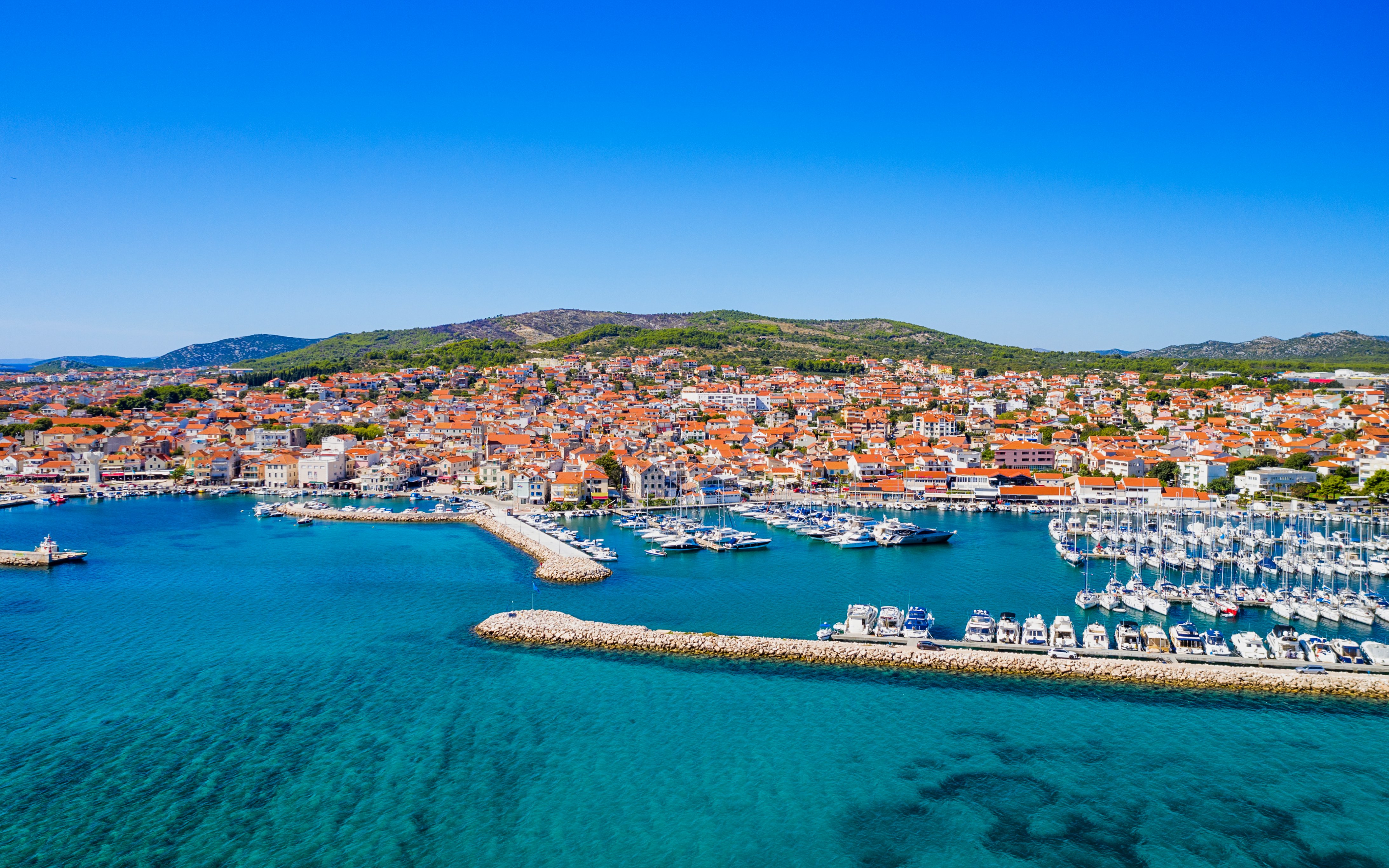 Aerial view of Vodice town and turquoise Adriatic coastline, Croatia.