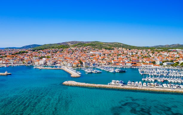 Aerial view of Vodice town and turquoise Adriatic coastline, Croatia.
