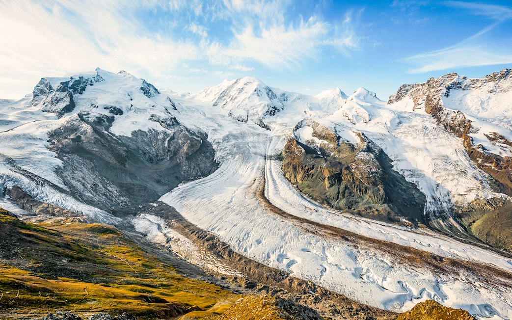 Dufourspitze Monte Rosa view from platform with snow-covered peaks and glacier.