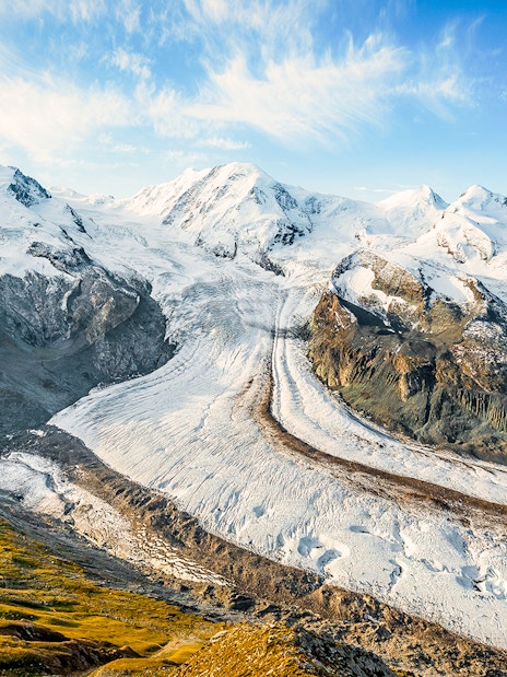 Dufourspitze Monte Rosa view from platform with snow-covered peaks and glacier.