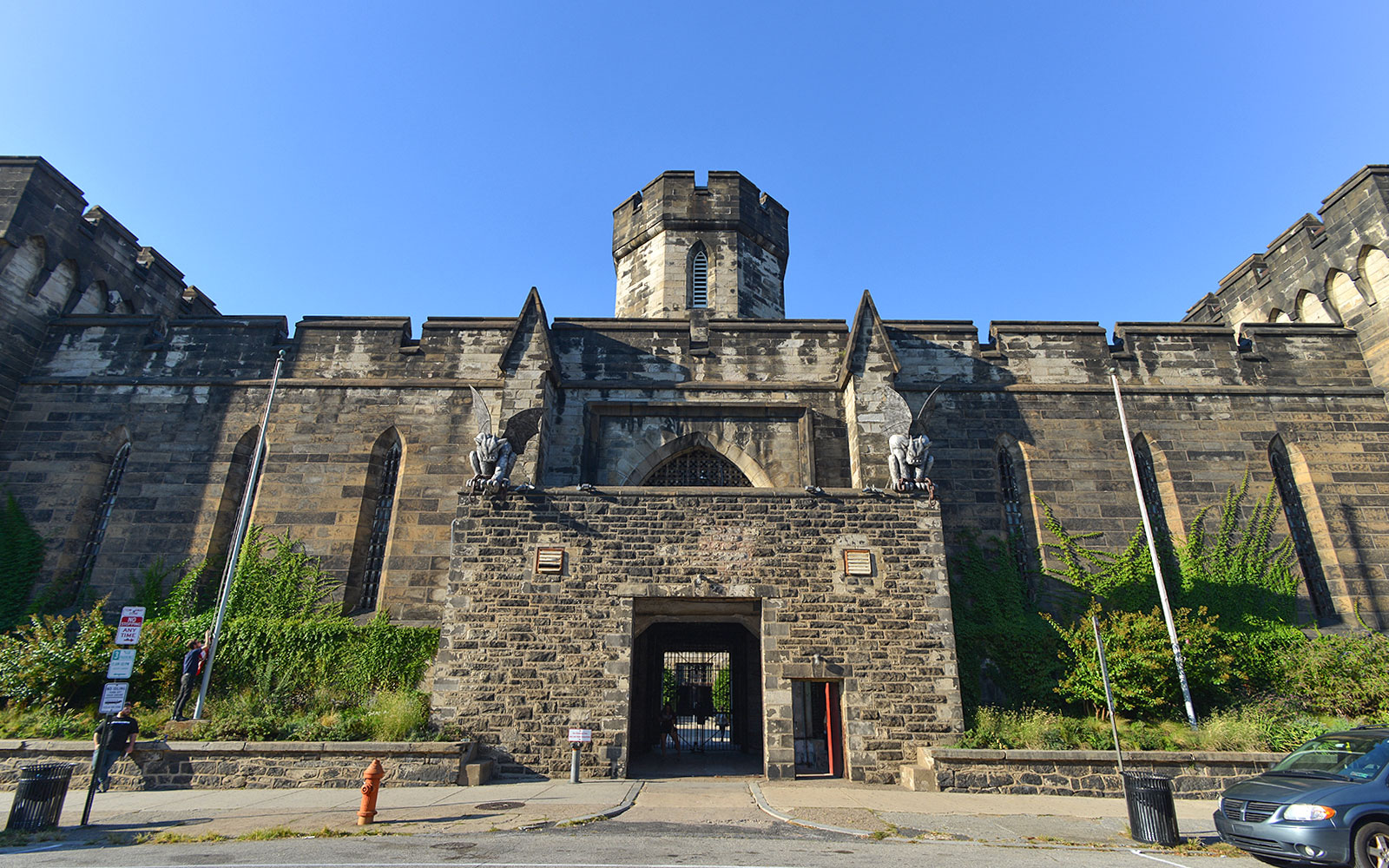 Eastern State Penitentiary entrance with stone gargoyles and historic architecture.