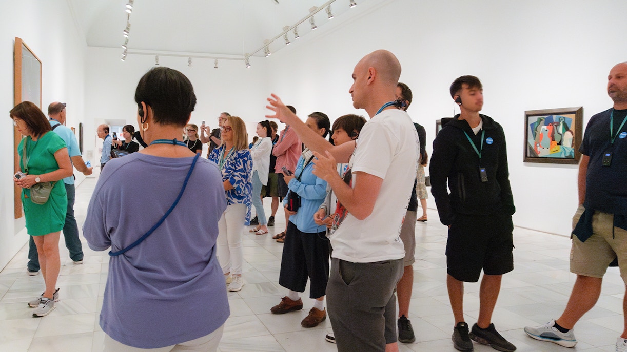 Visitors exploring art exhibits at Prado & Reina Sofia Museum, Madrid, with skip-the-line entry.