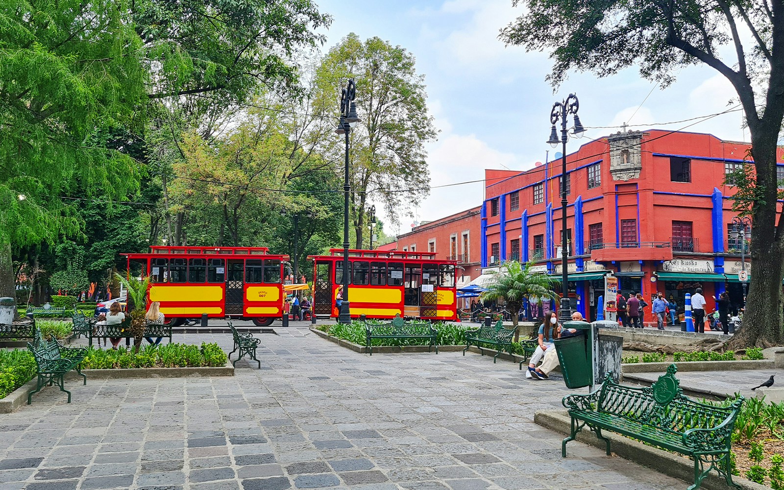 Frida Kahlo Museum in Coyoacán, Mexico City, showcasing vibrant blue exterior and lush garden.