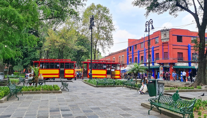 Frida Kahlo Museum in Coyoacán, Mexico City, showcasing vibrant blue exterior and lush garden.