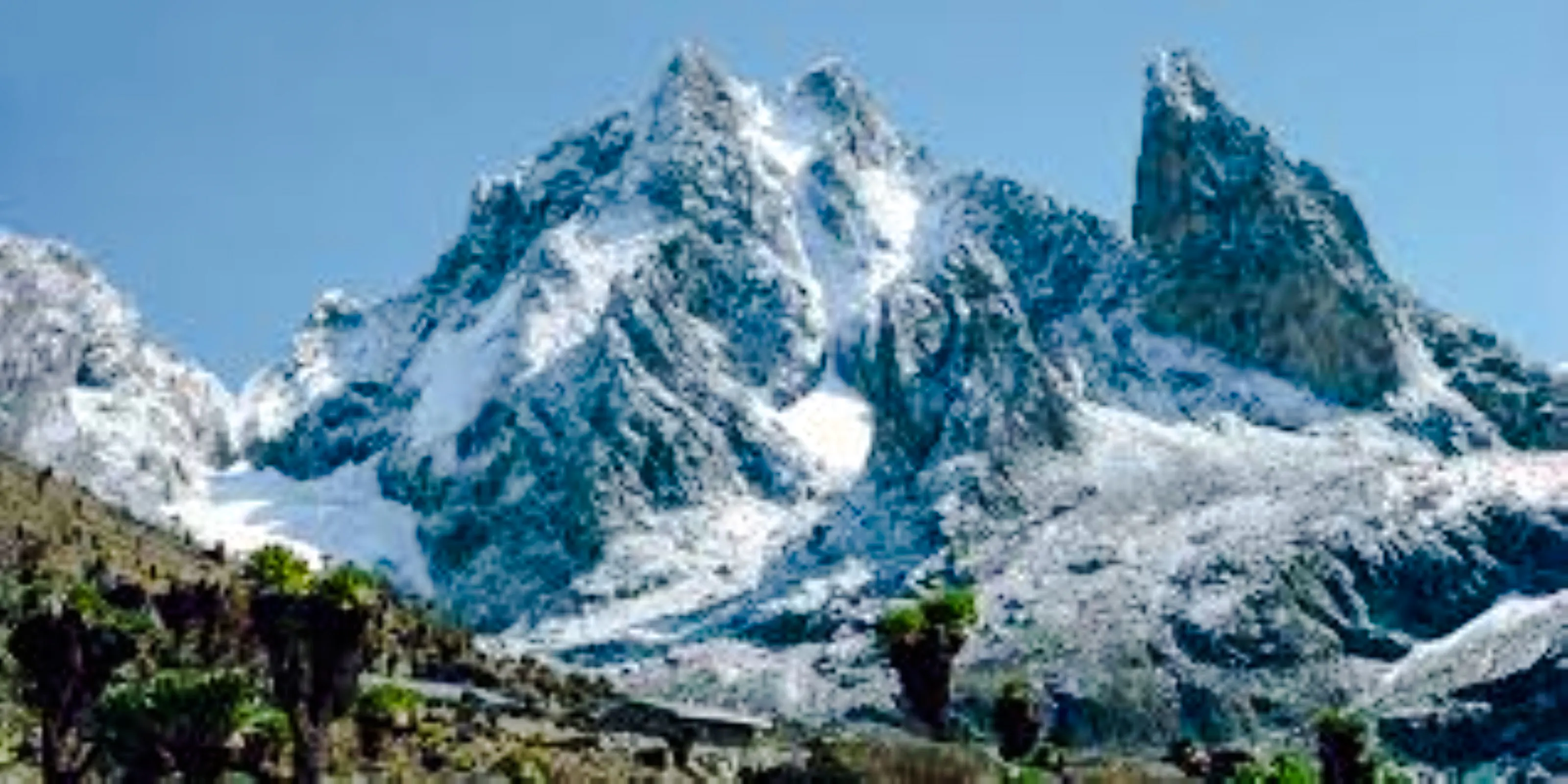 Snow-capped peaks of Mount Kenya on a clear day, viewed from Nairobi.