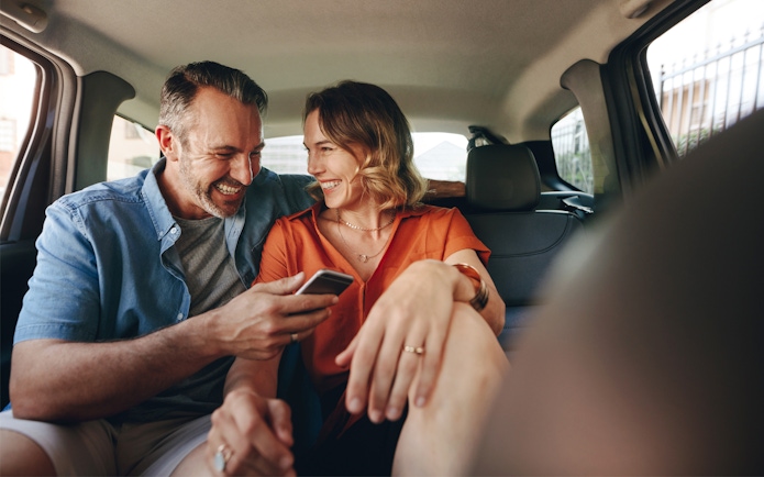 Couple enjoying private transfer to Andamanda Phuket Water Park.