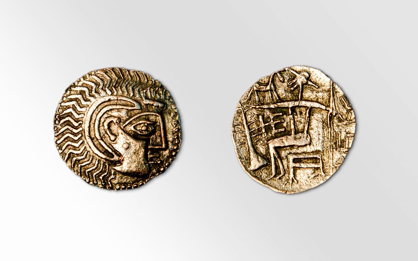 Ancient Abiel coin with intricate designs and symbols.