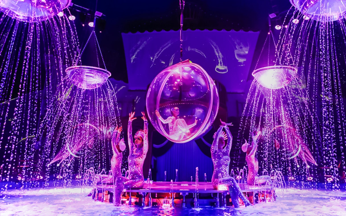 Aerial performers in water-themed show at Aqua Circus Phuket.