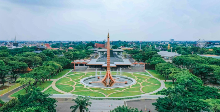 Aerial view of Taman Mini Indonesia showcasing cultural pavilions and lush gardens in Jakarta.