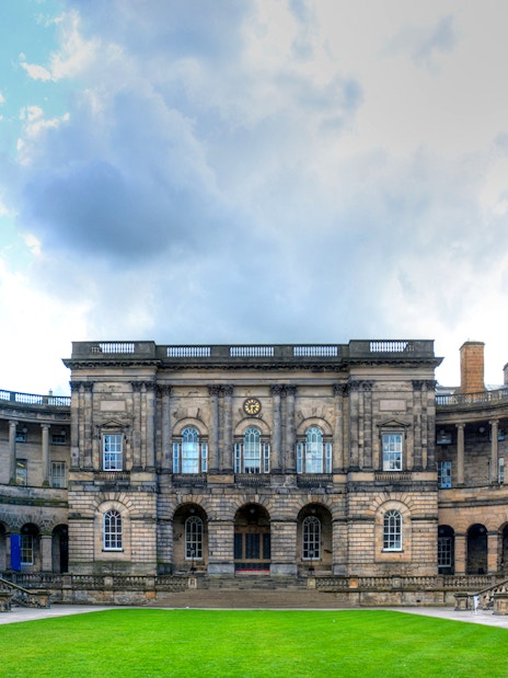 Courtyard of the University of Edinburgh, Scotland, with historic stone buildings.