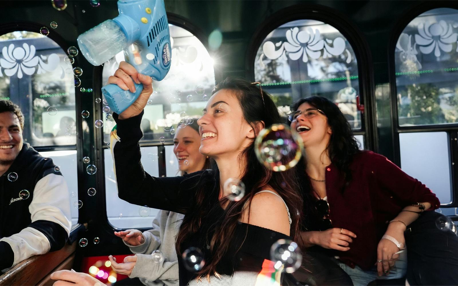 Tourists enjoying bubbles on the Savannah for Morons Trolley Tour.