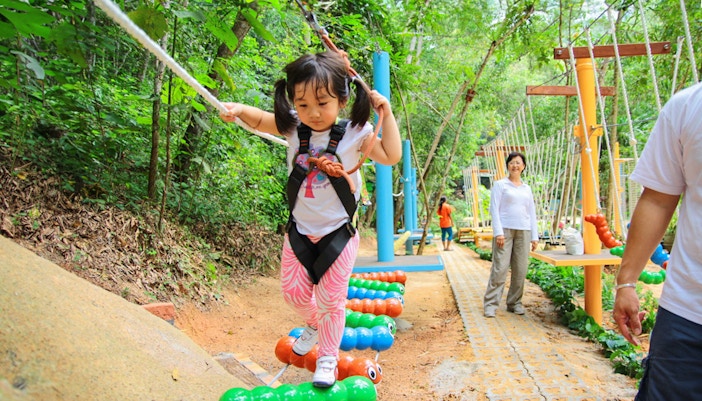 Kid having a good time at Monkey School in Escape Penang